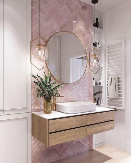 Pink bathroom tiles and free standing sink