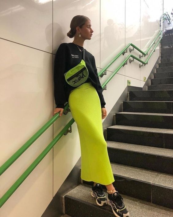 model wearing neon yellow skirt