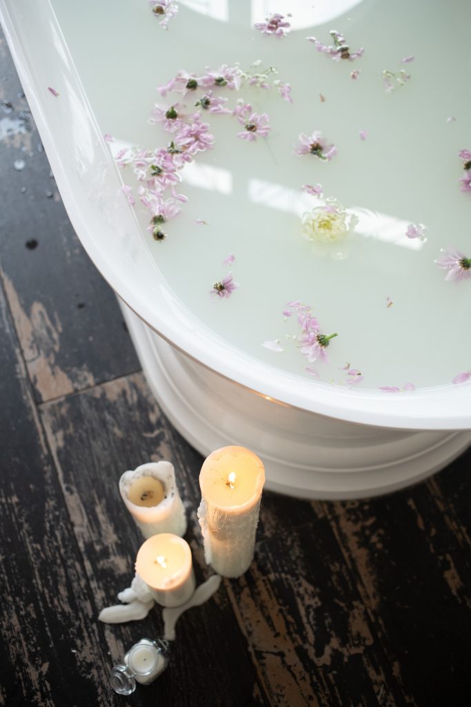 Candles next to a bath