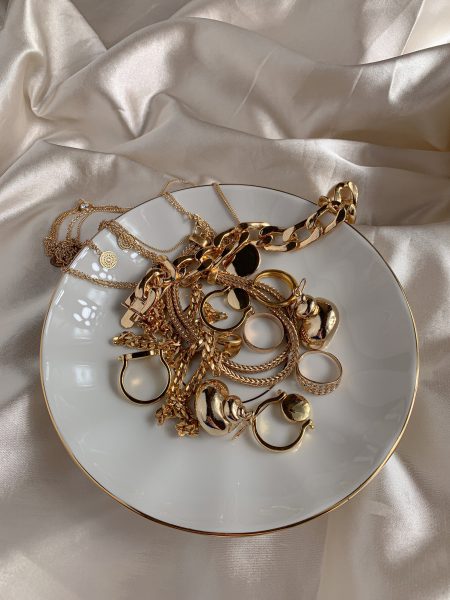 Gold jewellery on a plate