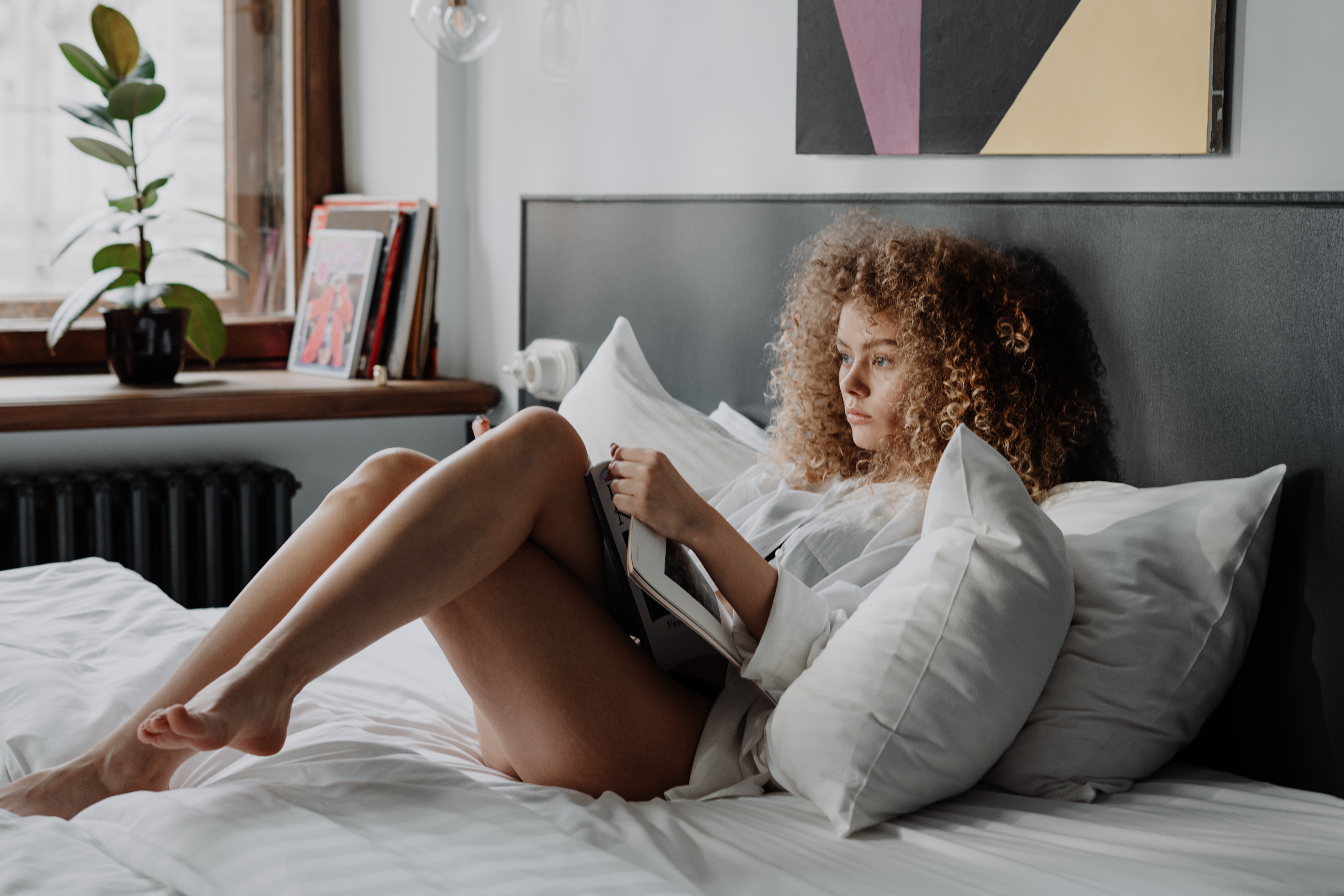 Woman reading in bed